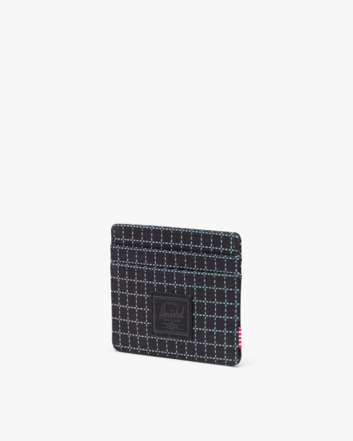 Black grid-patterned card holder with a brand logo on a white background