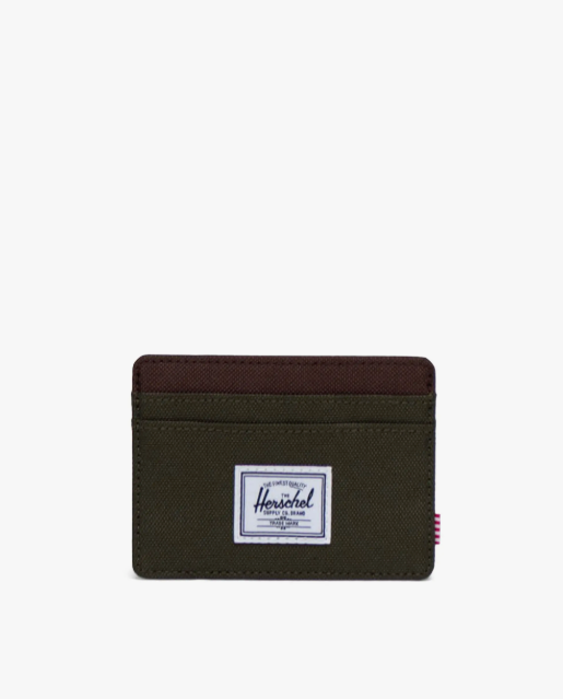 Green cardholder with Herschel logo on a white background