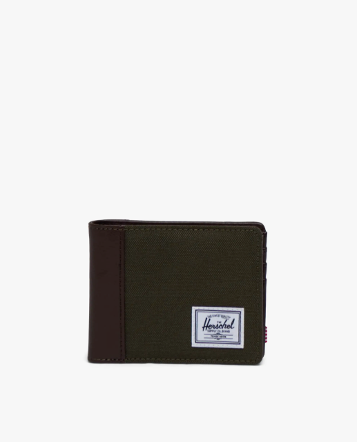 Green wallet with a dark brown spine and Herschel logo on a white background