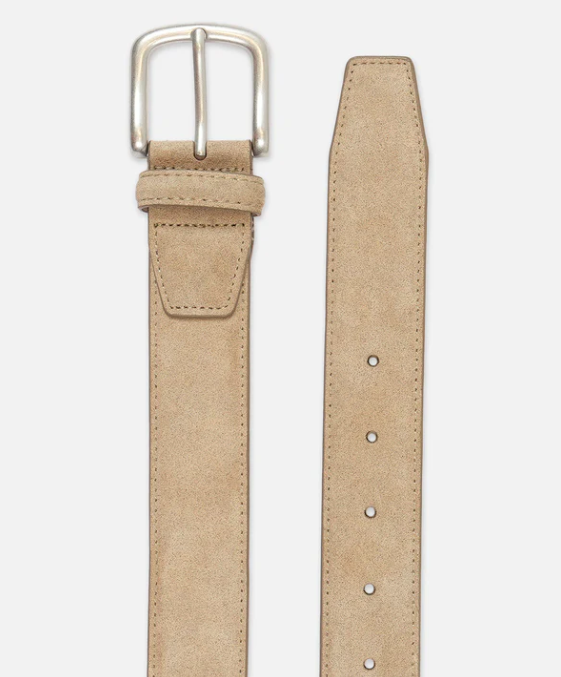 Beige belt with a silver buckle on a light gray background