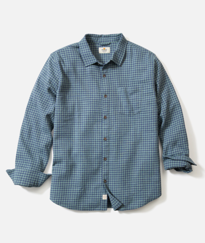 Blue and green checkered shirt on a light gray background