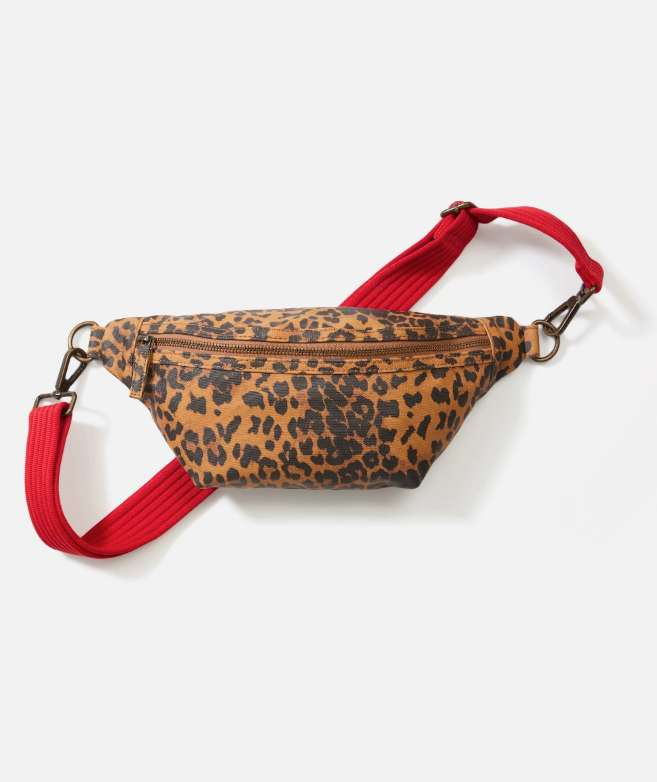Leopard print fanny pack with red strap on a white background