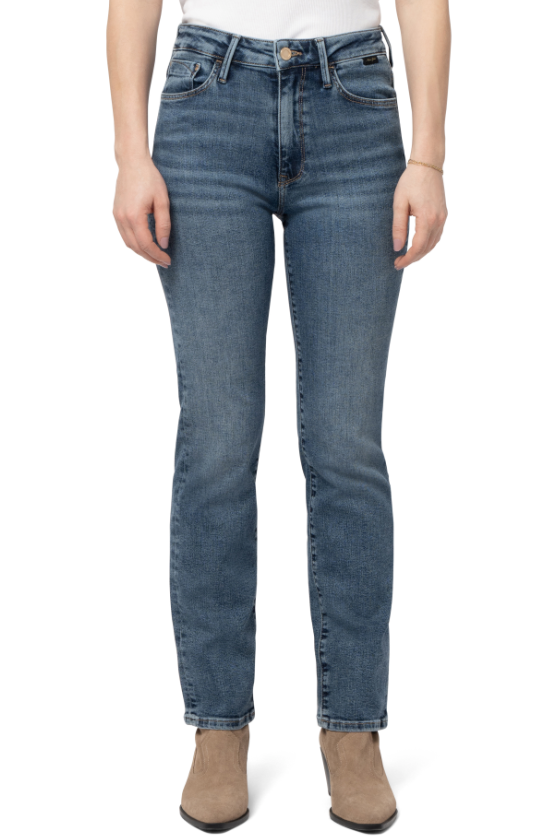 Person wearing blue jeans on a white background