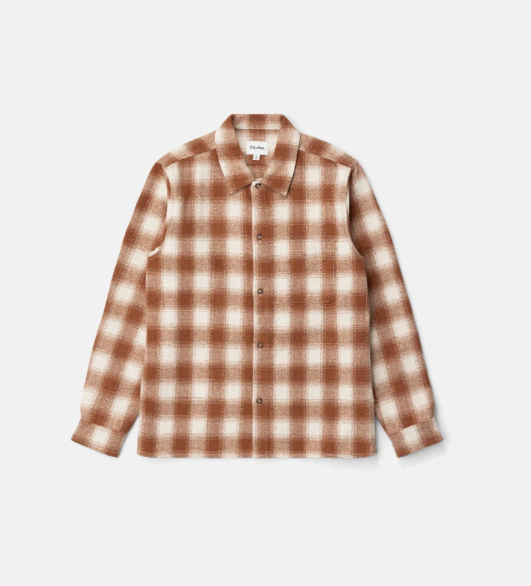 Burnt orange and white checkered shirt on a light gray background
