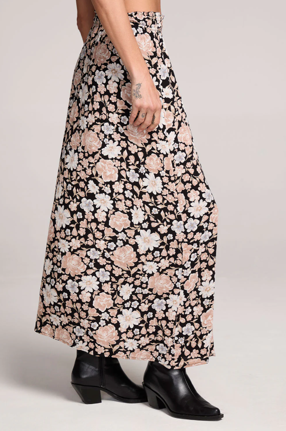 Floral patterned midi skirt worn by a person on a plain background