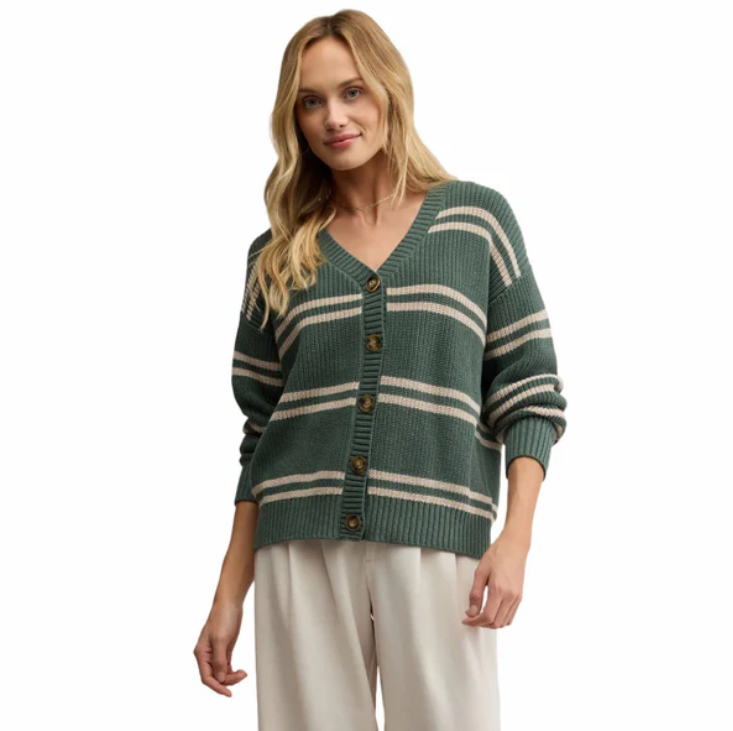 Woman wearing a green and beige striped cardigan on a white background
