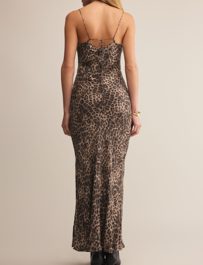 Leopard print midi dress worn by a person on a plain background